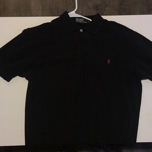 Black polo shirt with red symbol